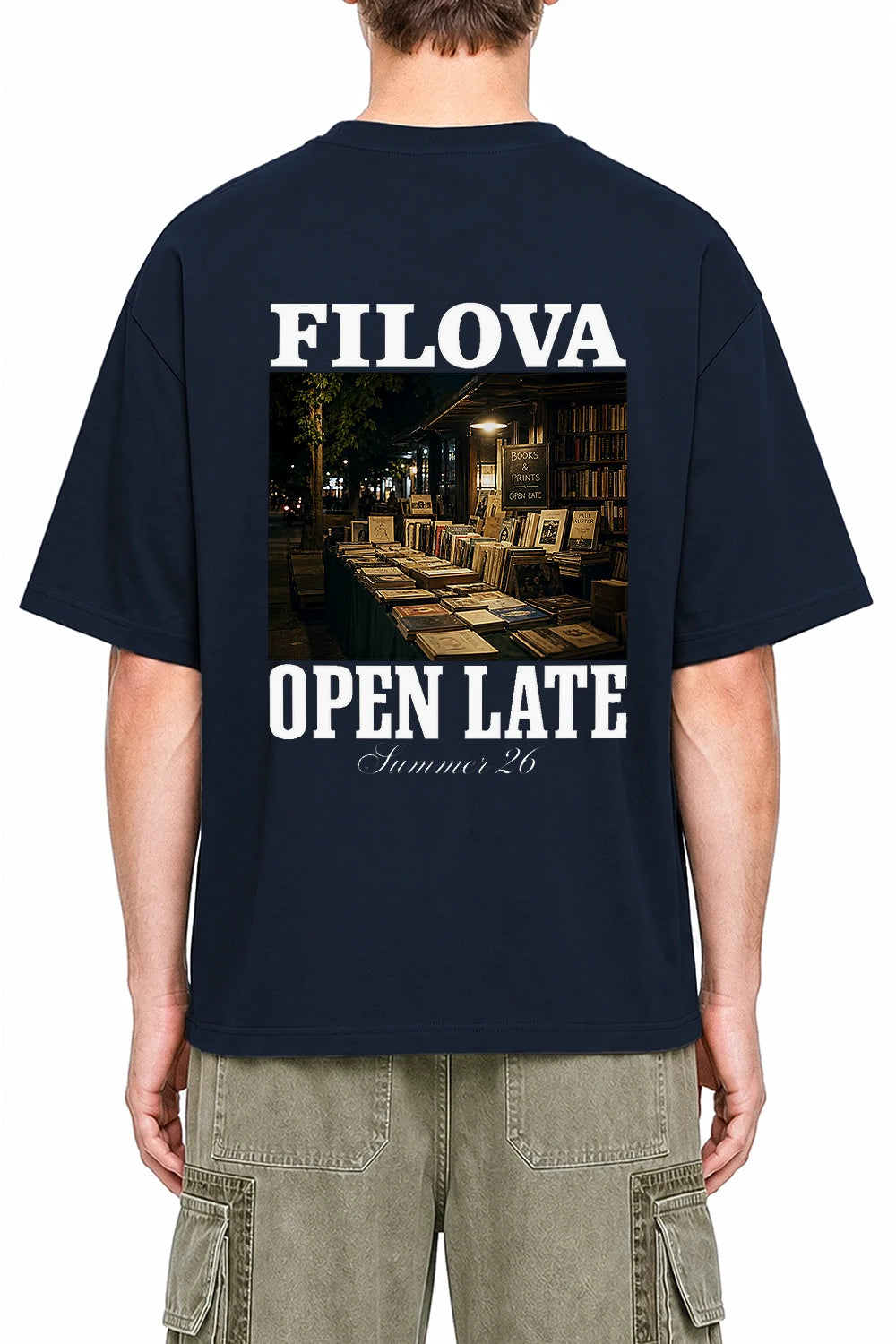 Open Late Book Market Navy Blue graphic T-shirt on model, back view