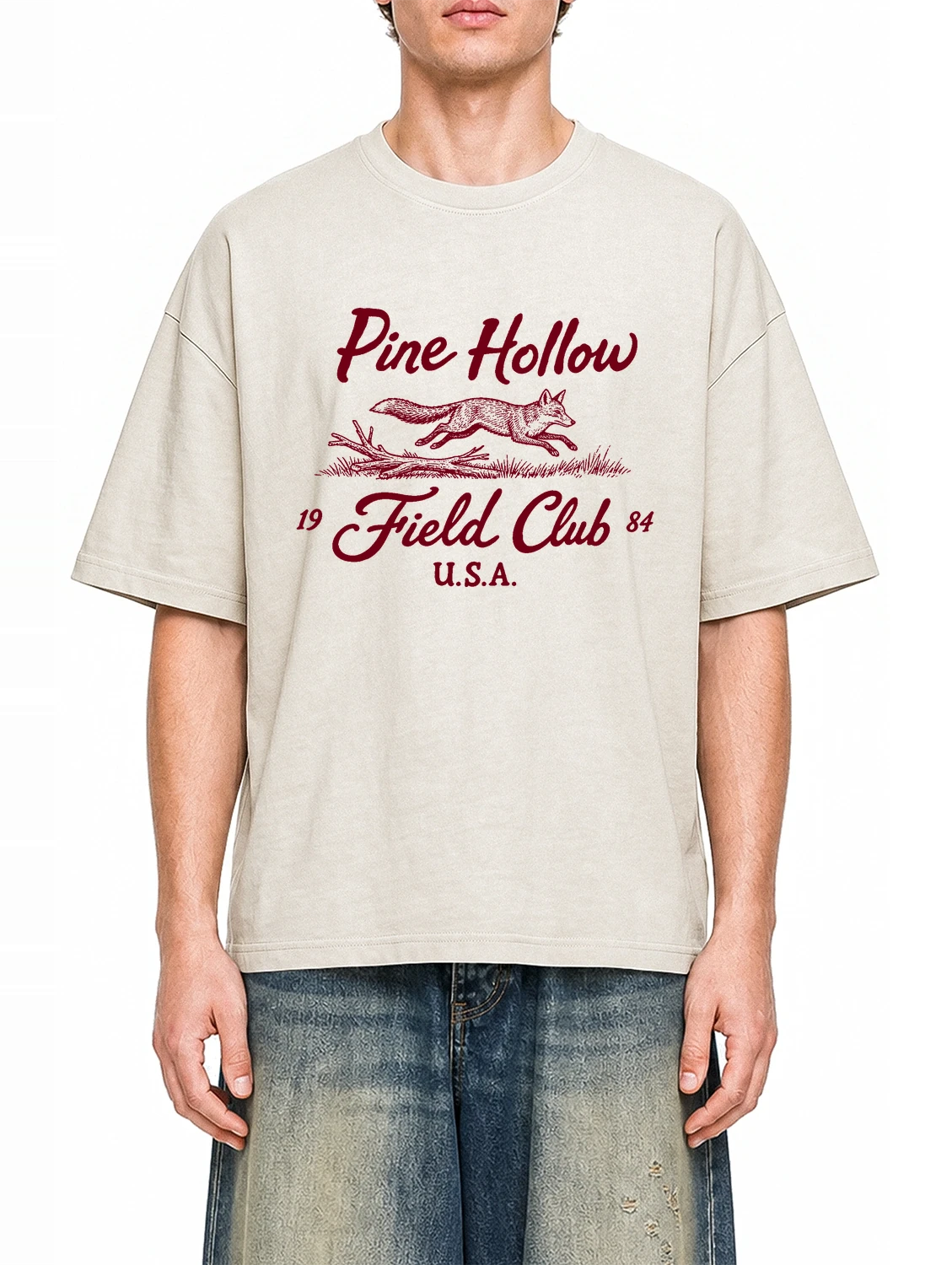 Pine Hollow Field Club Apricot graphic T-shirt on model, front view
