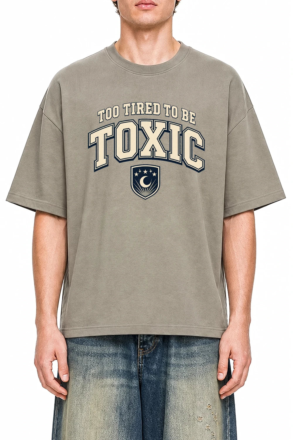 Too Tired To Be Toxic Dark Apricot graphic T-shirt on model, front view