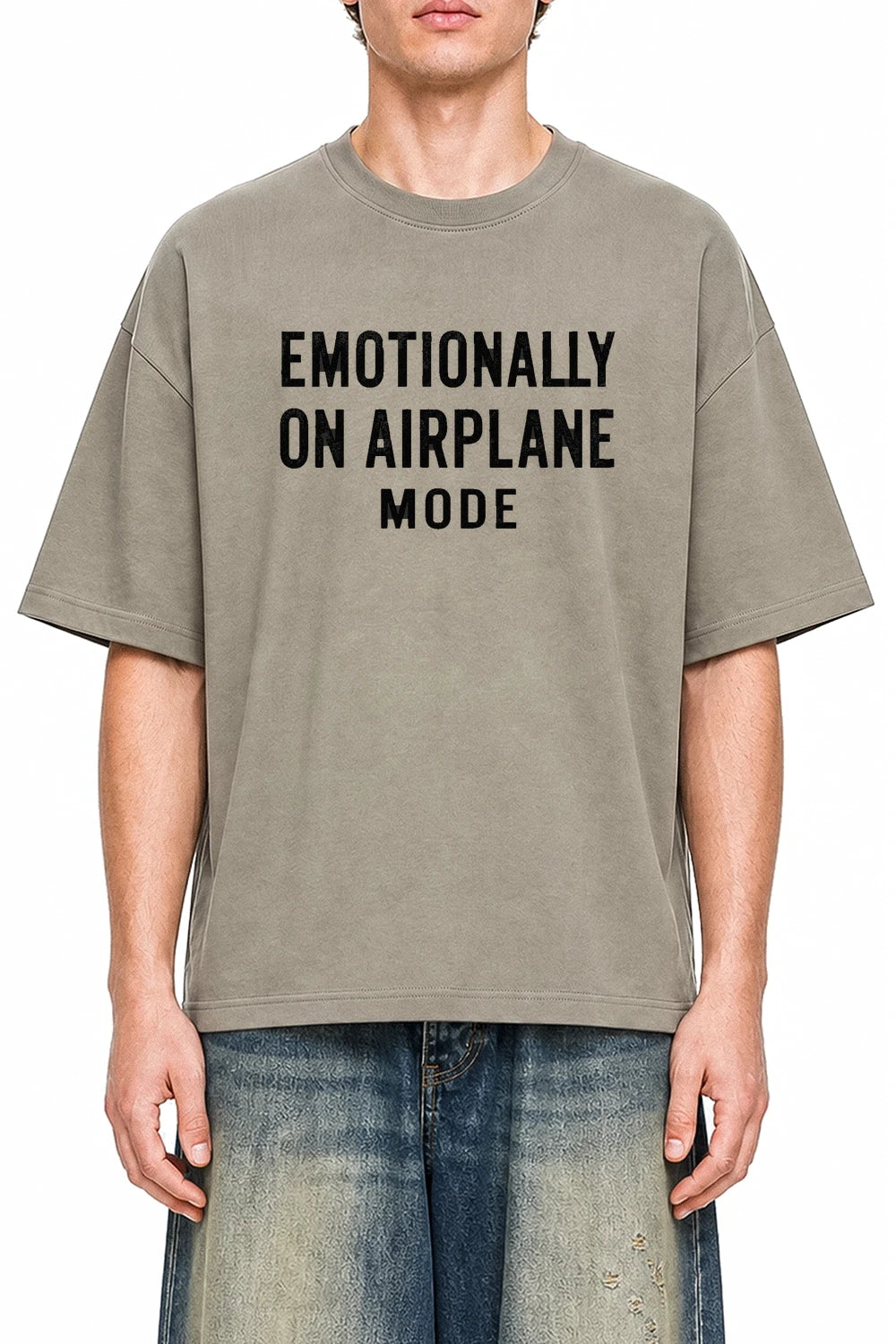 Emotionally On Airplane Mode Dark Apricot graphic T-shirt on model, front view