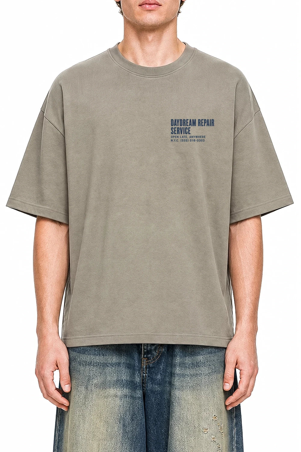 Daydream Repair Service Dark Apricot graphic T-shirt on model, front view