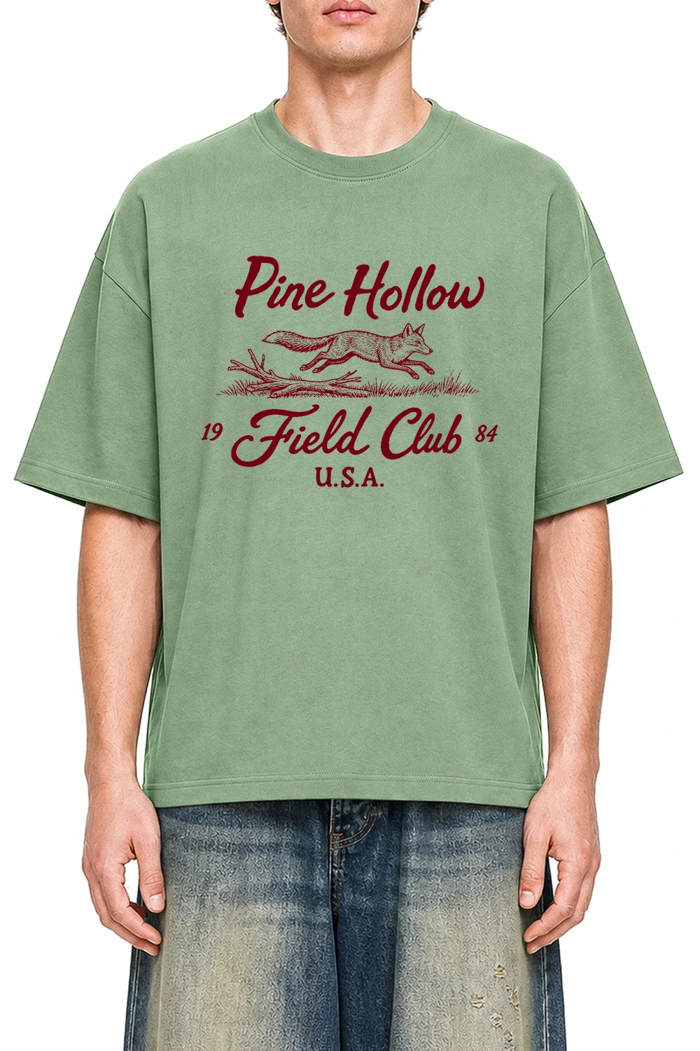 Pine Hollow Field Club Light Green graphic T-shirt on model, front view