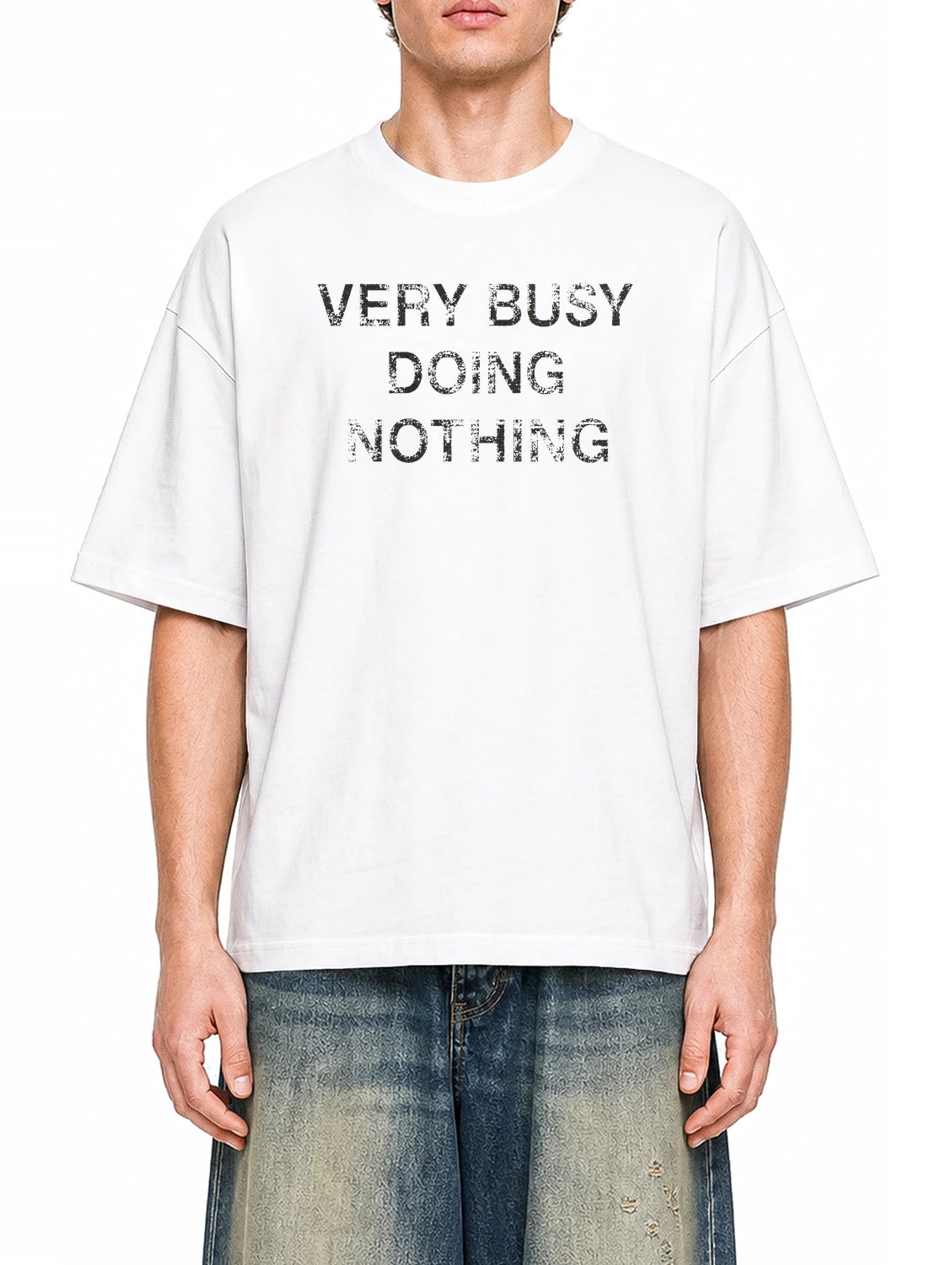 Very Busy Doing Nothing White graphic T-shirt on model, front view